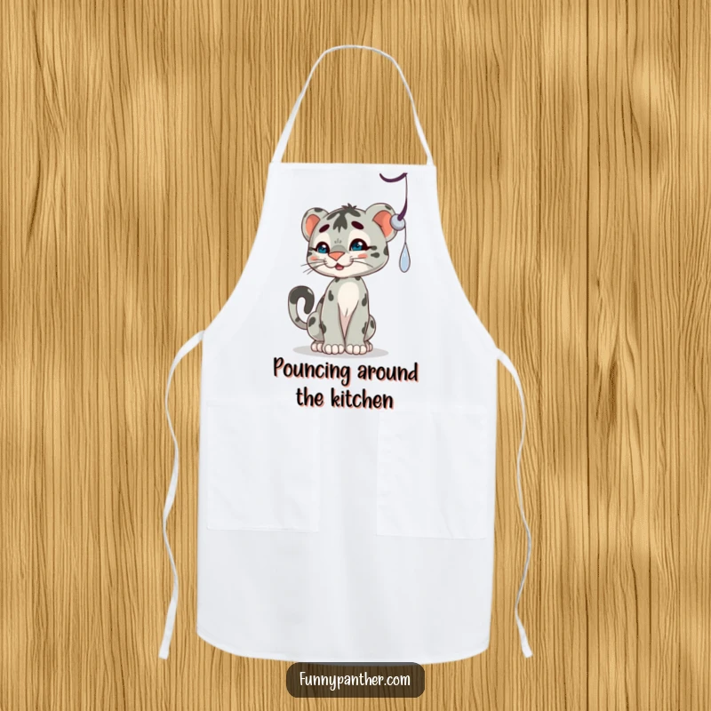Funny apron with a playful panther cub character batting at a dangling shadow, perfect for kitchen fun.