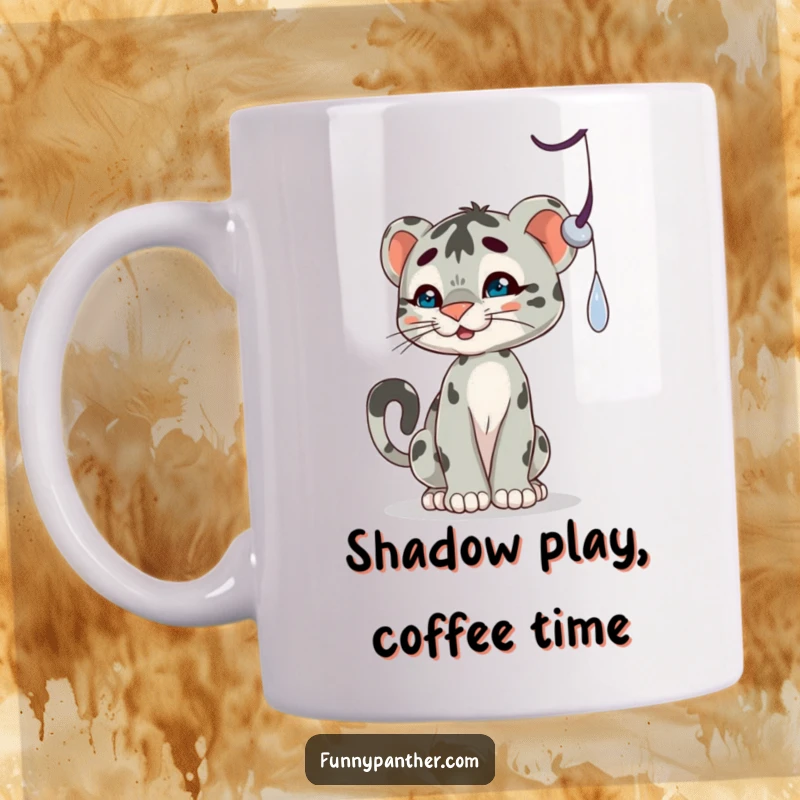 Funny mug with a playful panther cub character batting at a dangling shadow, capturing a moment of innocent mischief.