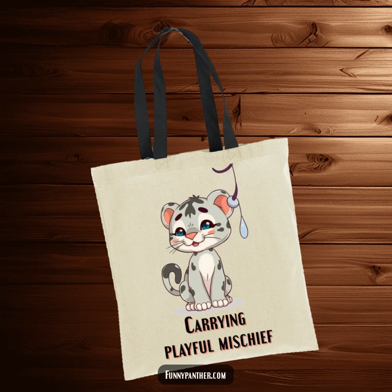 Funny tote bag with a playful panther cub character batting at a dangling shadow, perfect for carrying essentials with a smile.